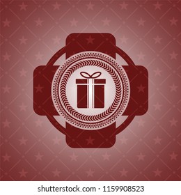 gift box icon inside realistic red emblem