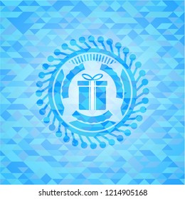 gift box icon inside realistic light blue emblem. Mosaic background