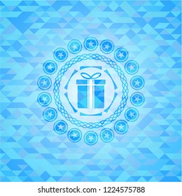 gift box icon inside realistic light blue mosaic emblem