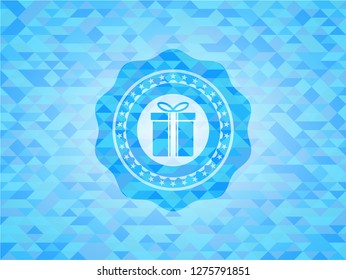 gift box icon inside realistic light blue emblem. Mosaic background