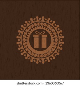 gift box icon inside realistic wood emblem