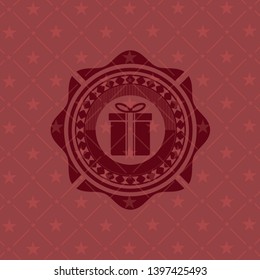 gift box icon inside red icon or emblem