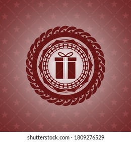gift box icon inside red icon or emblem. 