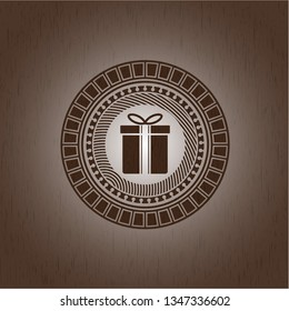gift box icon inside retro style wood emblem