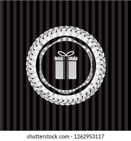 gift box icon inside silver badge