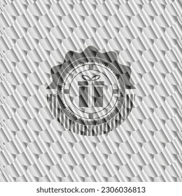 gift box icon inside silver badge or emblem. Scales pattern. Vector Illustration. Detailed. 