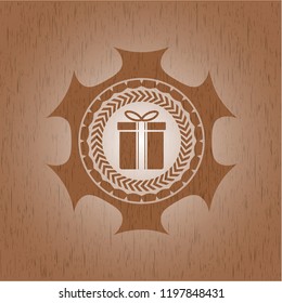 gift box icon inside vintage wood emblem