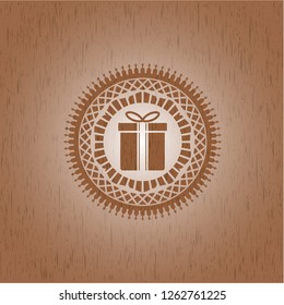 gift box icon inside vintage wood emblem