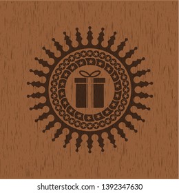 gift box icon inside vintage wood emblem