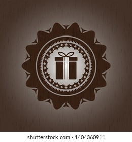 gift box icon inside vintage wooden emblem