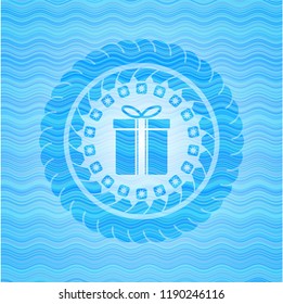 gift box icon inside water wavec oncept emblem.