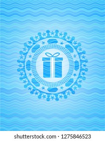 gift box icon inside water wave concept badge.