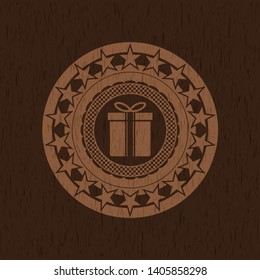 gift box icon inside wood emblem