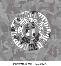 gift box icon on grey camouflage texture