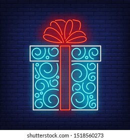 Gift box neon sign. Present, carton wrap, tag, ribbon, bow, ornament. Vector illustration in neon style for topics like surprise holiday, shopping