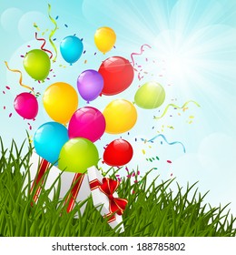 Gift box on green grass