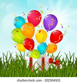 Gift box on green grass