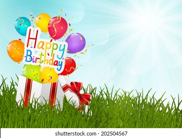 Gift box on green grass