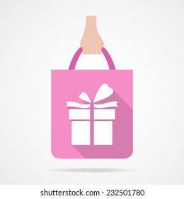 Gift box on pink shopping bag icon.  Flat design.Vector EPS 10