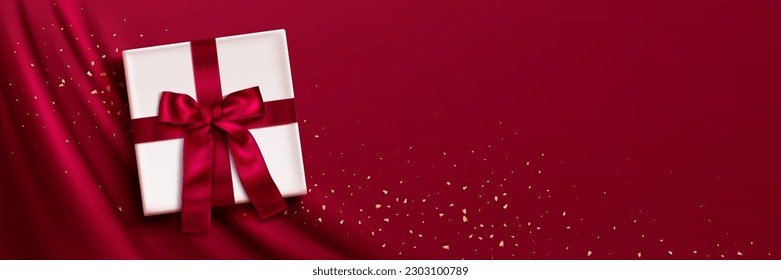 Gift box on viva magenta vector fabric background for Christmas sale banner and gold confetti. White present with red bow decoration on silk cloth with drape. Premium valentine header template