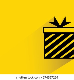 gift box on yellow background, flat and shadow theme
