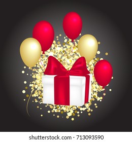 Gift box with a red bow, balloons and golden glitter.