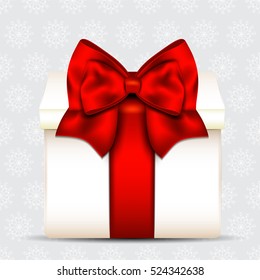 Gift box with red bow on christmas background.