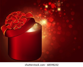 gift box with red bow over bright holiday background