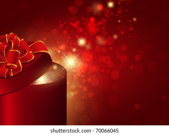 gift box with red bow over bright holiday background