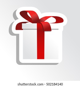 Gift box with red ribbon