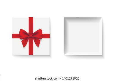 Gift box with red ribbon and bow. White box with lid open.