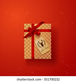 gift box with red ribbon bow with deer label