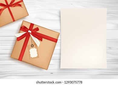 Gift box with red ribbon and white paper for holiday concept.