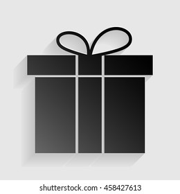 Gift box sign. Black paper with shadow on gray background.
