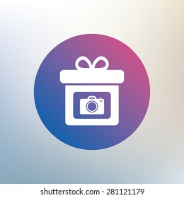 Gift box sign icon. Present with photo camera symbol. Icon on blurred background. Vector