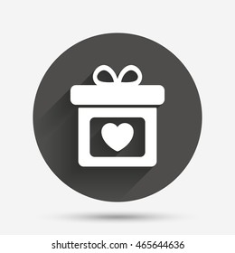 Gift box sign icon. Present with heart love symbol. Circle flat button with shadow. Vector