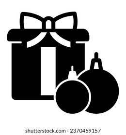 Gift Box with toy ball solid icon, Winter season concept, Christmas composition sign on white background, New Year present and tree toys icon in glyph style for mobile. Vector graphics
