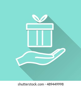 Gift Box vector icon with long shadow. White illustration isolated on green background for graphic and web design.