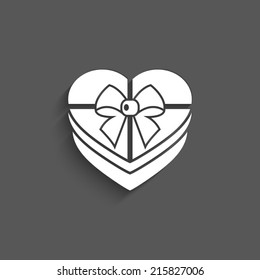 Gift box vector icon with shadow on a grey background