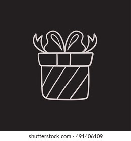 Icono de esbozo vectorial de caja de regalo aislado en el fondo. Icono de la caja de regalo dibujado a mano. Icono de esbozo de la caja de regalo para infografía, sitio web o aplicación.