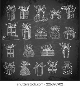 Gift boxes icons on blackboard. Hand-drawn doodle sketch illustration. 