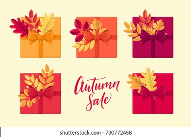Gift boxes with various autumn leaves set. Oak, mountain ash, rowan, hawthorn. Autumn sale lettering. Top view. Design elements for invitation, banner, card, poster, flyer, gift certificate