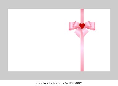 Gift Card With Pink Ribbon And A Bow decorated with  heart. Pink satin gift ribbon and bow border isolated on white.
