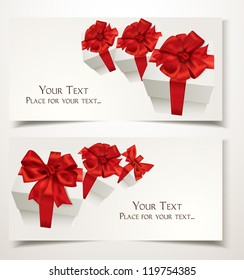 Gift cards with gift boxes and red bows on the white background