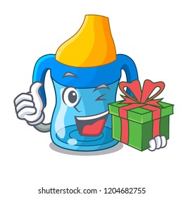 With gift cartoon baby drinking from training cup