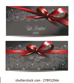 gift certificates with silk red ribbons and floral design