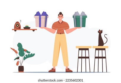 Gift concept for christmas or new year. The guy holds a festive gift box in his hands.