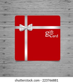 Gift coupon with gift bow and ribbon. Vector illustration.