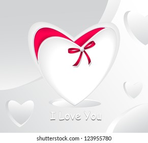 Gift in form white heart and with red bow pearl