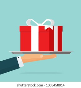 Gift giving vector illustration, flat cartoon person hand offering red gift box present isolated, give away package or idea of giveaway